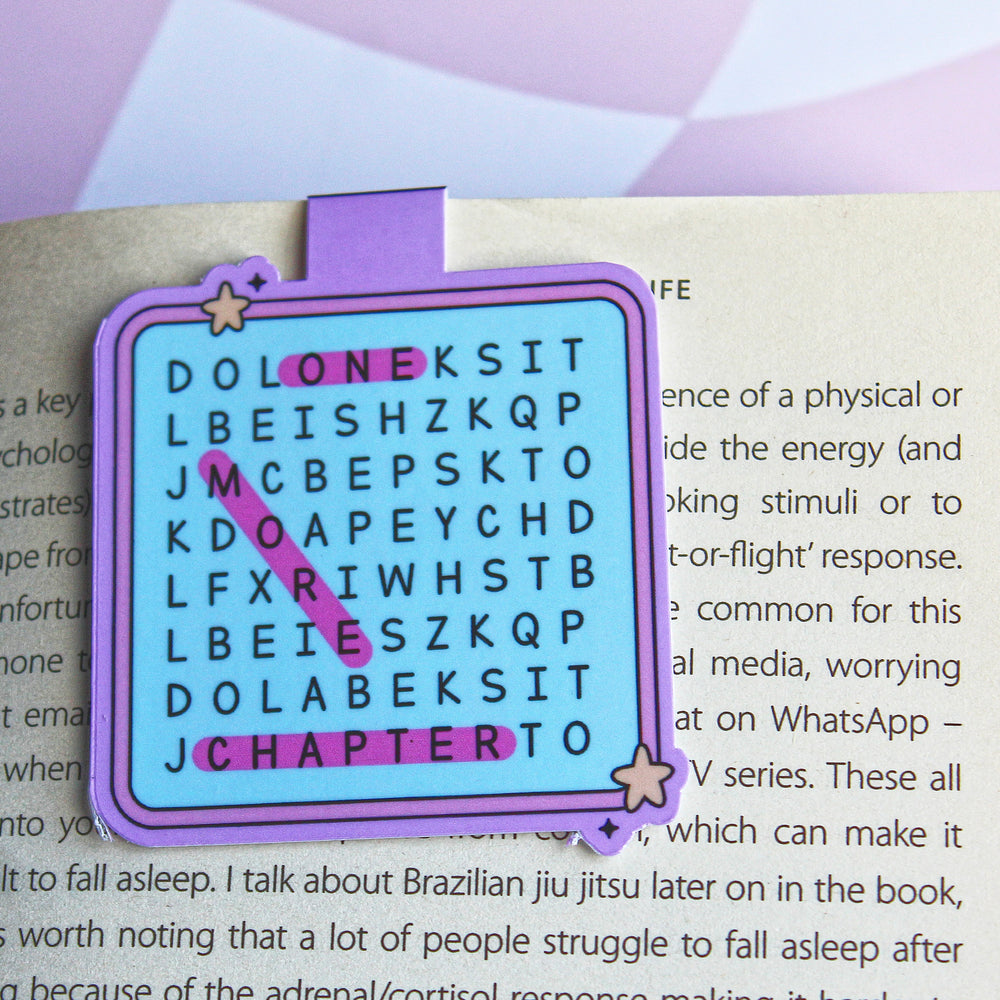 Purple word search bookmark on an open book with text.
