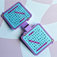 Load image into Gallery viewer, one open bookends with crossword-style text on a checkered background
