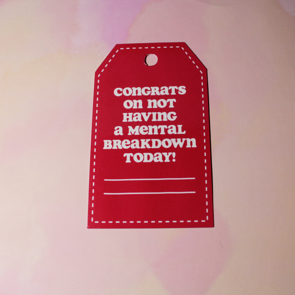Red tag with white text on a blurred background