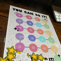 Load image into Gallery viewer, Motivational poster with colorful circles and stars on a wooden surface
